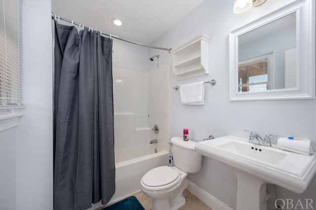 full bathroom with tile patterned flooring, toilet, a sink, baseboards, and shower / bathtub combination with curtain