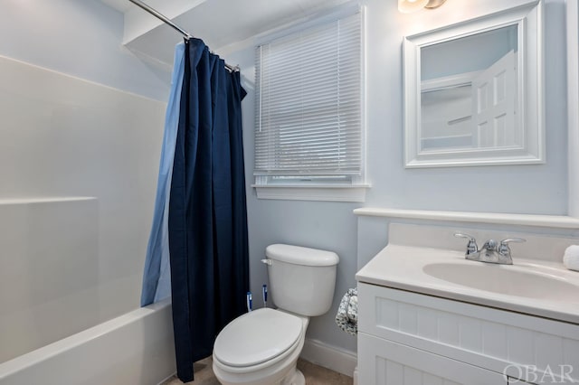 full bath featuring toilet, shower / bath combo, vanity, and baseboards