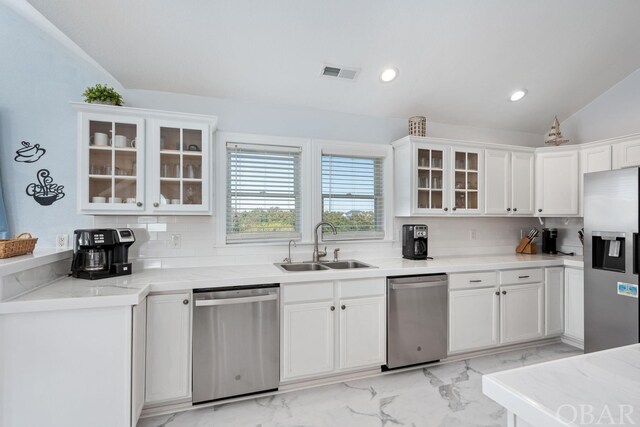 kitchen featuring visible vents, appliances with stainless steel finishes, glass insert cabinets, and white cabinets