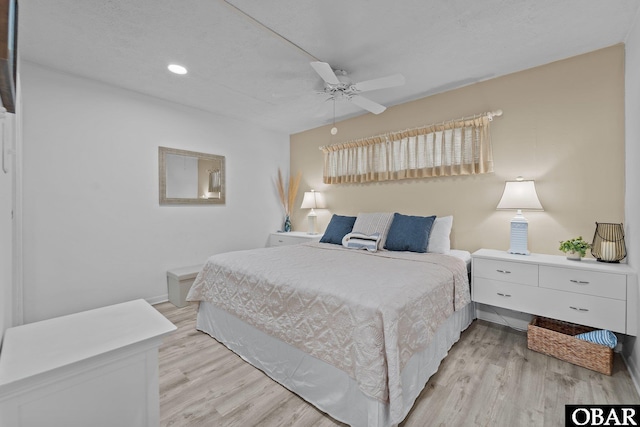 bedroom featuring a ceiling fan and light wood-type flooring