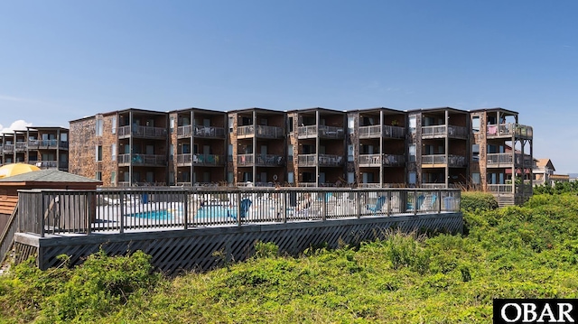 view of building exterior featuring a community pool