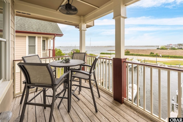 202 Dartmoor Ave Unit 202-C, Manteo, NC 27954 - wooden terrace with a water view and ceiling fan