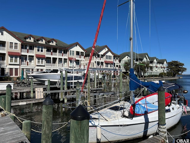 202 Dartmoor Ave Unit 202-C, Manteo, NC 27954 - view of dock with boat lift and a water view