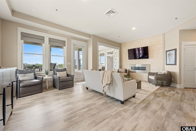 202 Dartmoor Ave Unit 202-C, Manteo, NC 27954 - living area featuring a large fireplace, light wood-style flooring, recessed lighting, and baseboards