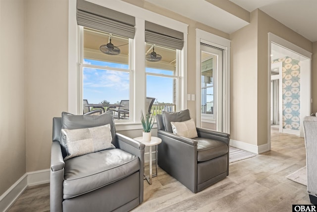 202 Dartmoor Ave Unit 202-C, Manteo, NC 27954 - sitting room with wood finished floors and baseboards