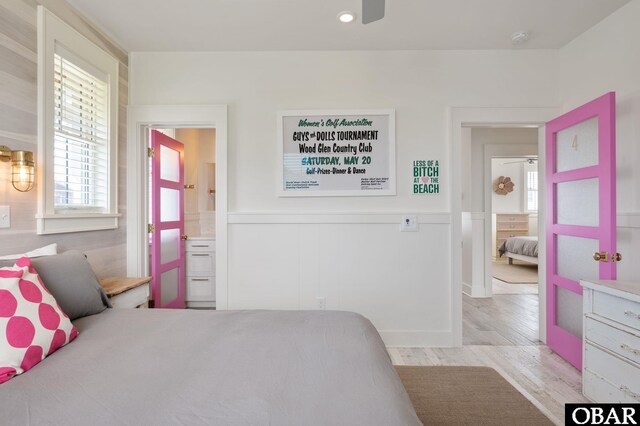 5118 N Virginia Dare Trl Lot 7, Kitty Hawk, NC 27949 - bedroom with wainscoting and light wood-style floors