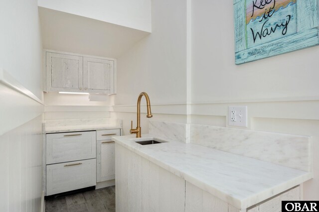 5118 N Virginia Dare Trl Lot 7, Kitty Hawk, NC 27949 - kitchen with white cabinetry, wood finished floors, and light stone counters