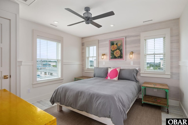 5118 N Virginia Dare Trl Lot 7, Kitty Hawk, NC 27949 - bedroom featuring multiple windows, a wainscoted wall, recessed lighting, and a ceiling fan