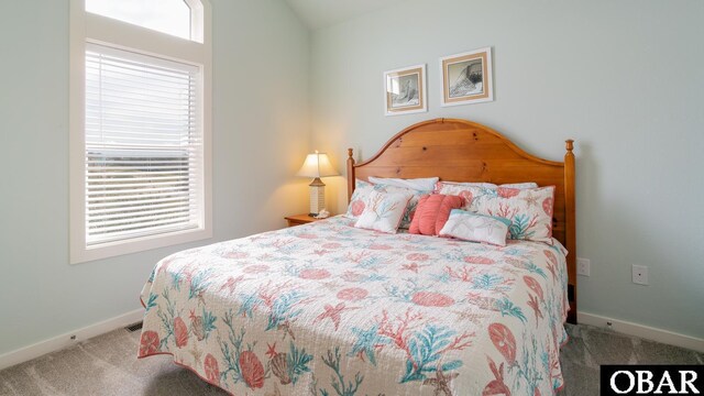 carpeted bedroom with baseboards