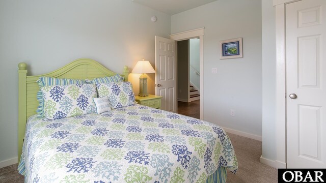 carpeted bedroom with baseboards