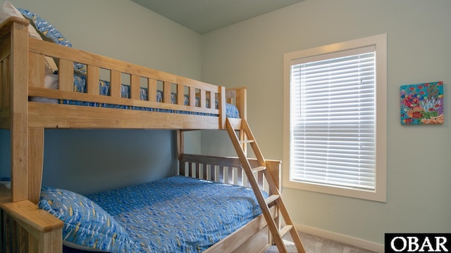 bedroom featuring carpet flooring and baseboards