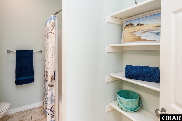 full bathroom with baseboards, a shower with curtain, toilet, and tile patterned floors