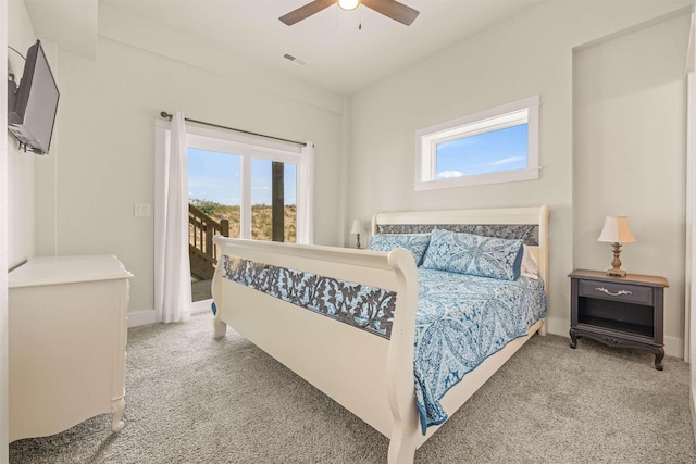 2103 Sandfiddler Rd Lot # 25, Corolla, NC 27927 - carpeted bedroom featuring multiple windows, access to outside, ceiling fan, and baseboards