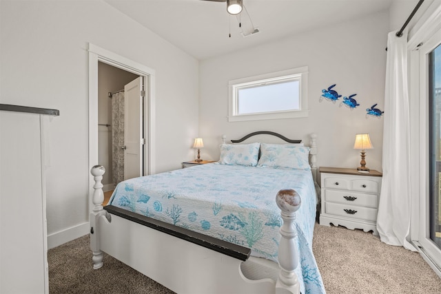 2103 Sandfiddler Rd Lot # 25, Corolla, NC 27927 - carpeted bedroom featuring baseboards and connected bathroom