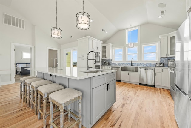 2103 Sandfiddler Rd Lot # 25, Corolla, NC 27927 - kitchen with dishwasher, a sink, light wood finished floors, and high vaulted ceiling