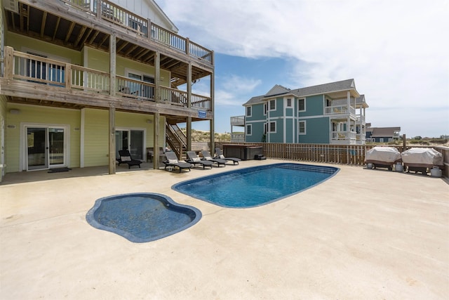2103 Sandfiddler Rd Lot # 25, Corolla, NC 27927 - view of swimming pool with stairs, a hot tub, a patio, and a deck
