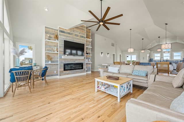 2103 Sandfiddler Rd Lot # 25, Corolla, NC 27927 - living room with a ceiling fan, a fireplace, wood finished floors, and high vaulted ceiling
