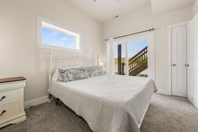 2103 Sandfiddler Rd Lot # 25, Corolla, NC 27927 - carpeted bedroom with access to outside, multiple windows, and baseboards
