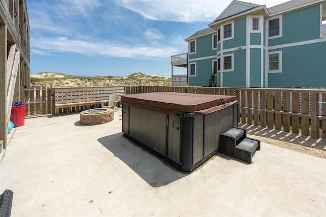 2103 Sandfiddler Rd Lot # 25, Corolla, NC 27927 - view of patio featuring a hot tub and an outdoor fire pit