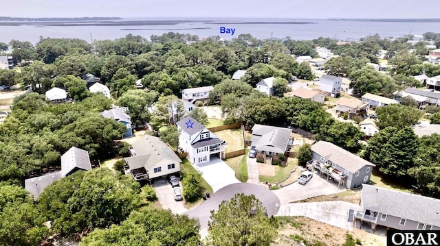 drone / aerial view with a water view and a residential view