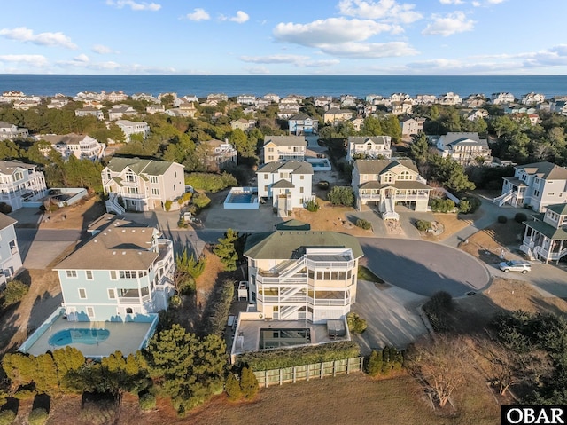 aerial view with a water view and a residential view