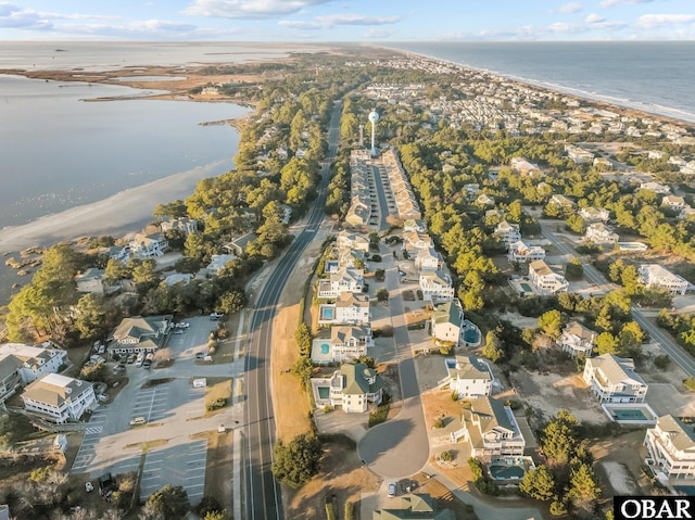 birds eye view of property with a water view and a residential view