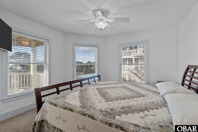 carpeted bedroom featuring a ceiling fan