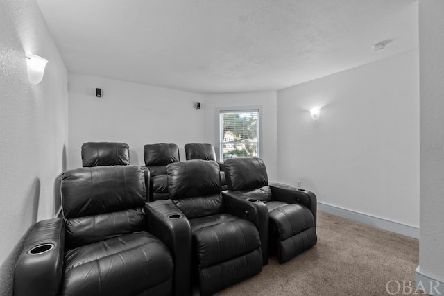 carpeted home theater room featuring baseboards