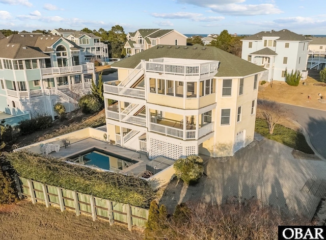 view of building exterior with a residential view and driveway