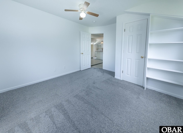 5707 Caratoke Hwy, Poplar Branch, NC 27965 - unfurnished bedroom with baseboards, ceiling fan, and carpet