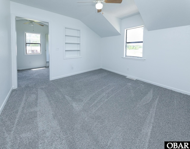 5707 Caratoke Hwy, Poplar Branch, NC 27965 - additional living space with baseboards, plenty of natural light, ceiling fan, and built in shelves