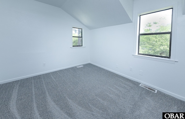5707 Caratoke Hwy, Poplar Branch, NC 27965 - bonus room featuring carpet floors, baseboards, vaulted ceiling, and visible vents