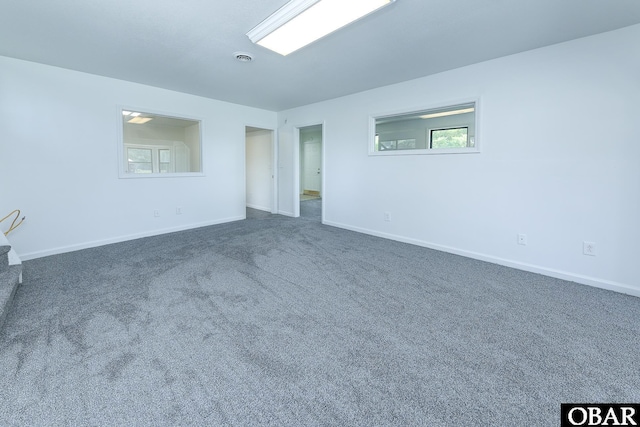 5707 Caratoke Hwy, Poplar Branch, NC 27965 - spare room with dark carpet, baseboards, and visible vents
