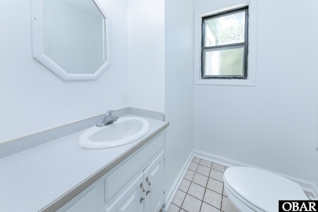 5707 Caratoke Hwy, Poplar Branch, NC 27965 - half bath with tile patterned floors, baseboards, vanity, and toilet