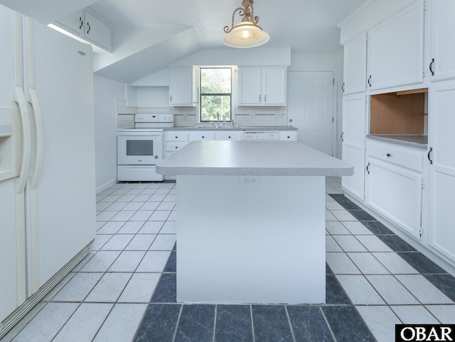 5707 Caratoke Hwy, Poplar Branch, NC 27965 - kitchen featuring decorative backsplash, a kitchen island, white appliances, white cabinetry, and light tile patterned floors