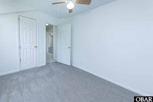 5707 Caratoke Hwy, Poplar Branch, NC 27965 - unfurnished bedroom with baseboards, a ceiling fan, and carpet