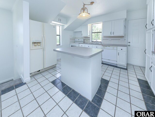 5707 Caratoke Hwy, Poplar Branch, NC 27965 - kitchen featuring a sink, light countertops, light tile patterned floors, and white appliances