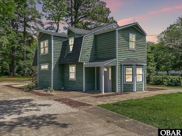 5707 Caratoke Hwy, Poplar Branch, NC 27965 - view of front facade featuring a shingled roof and a gambrel roof