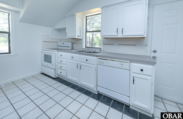 5707 Caratoke Hwy, Poplar Branch, NC 27965 - kitchen with white appliances, light countertops, white cabinets, tasteful backsplash, and a sink