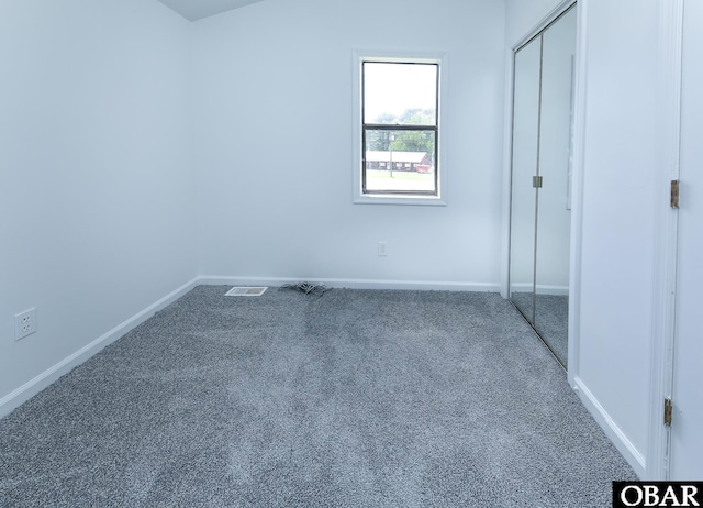 5707 Caratoke Hwy, Poplar Branch, NC 27965 - unfurnished bedroom featuring visible vents, baseboards, and carpet floors