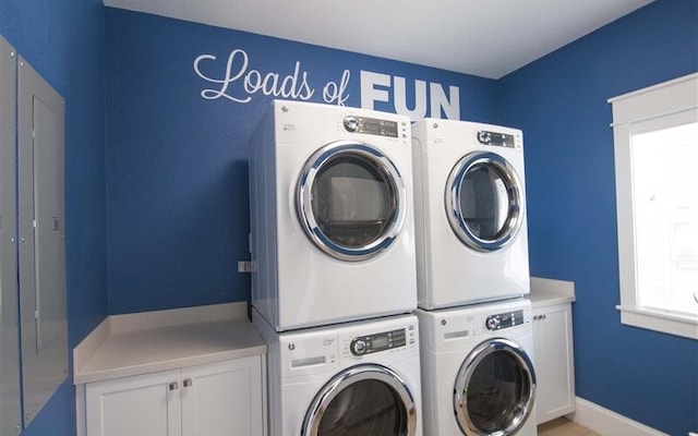 1905 S Virginia Dare Trl Lot E 3, Kill Devil Hills, NC 27948 - clothes washing area with cabinet space, stacked washer and dryer, independent washer and dryer, and baseboards