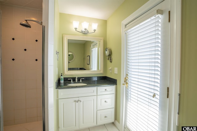 full bathroom featuring plenty of natural light, a stall shower, and vanity