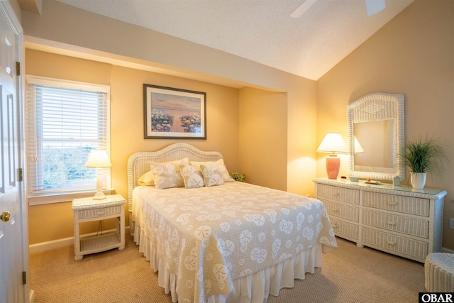 bedroom with baseboards, lofted ceiling, and light colored carpet