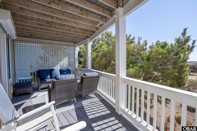 wooden terrace featuring an outdoor hangout area