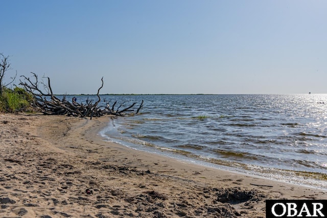 property view of water featuring a beach view