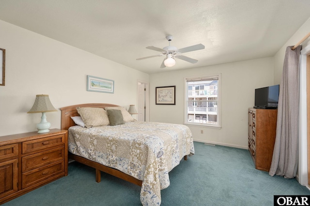 bedroom with baseboards, a ceiling fan, and carpet floors