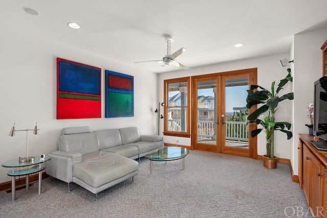 carpeted living area featuring baseboards, a ceiling fan, and recessed lighting