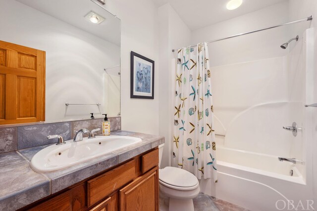 bathroom featuring tasteful backsplash, shower / tub combo, vanity, and toilet