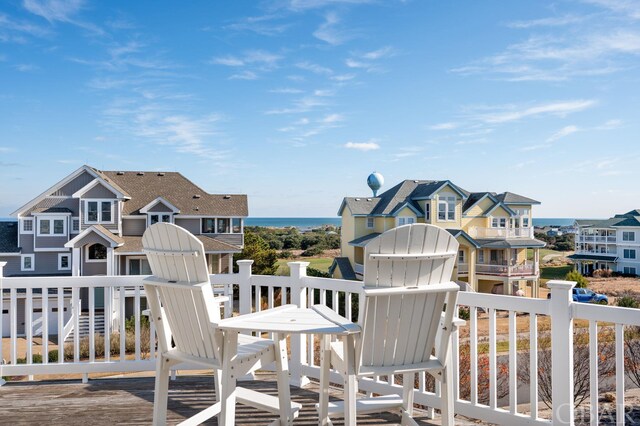 wooden terrace featuring a water view