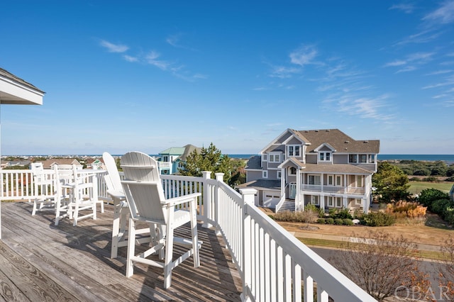 wooden deck with a water view